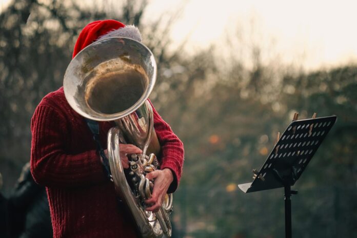 man playing on tuba outdoors