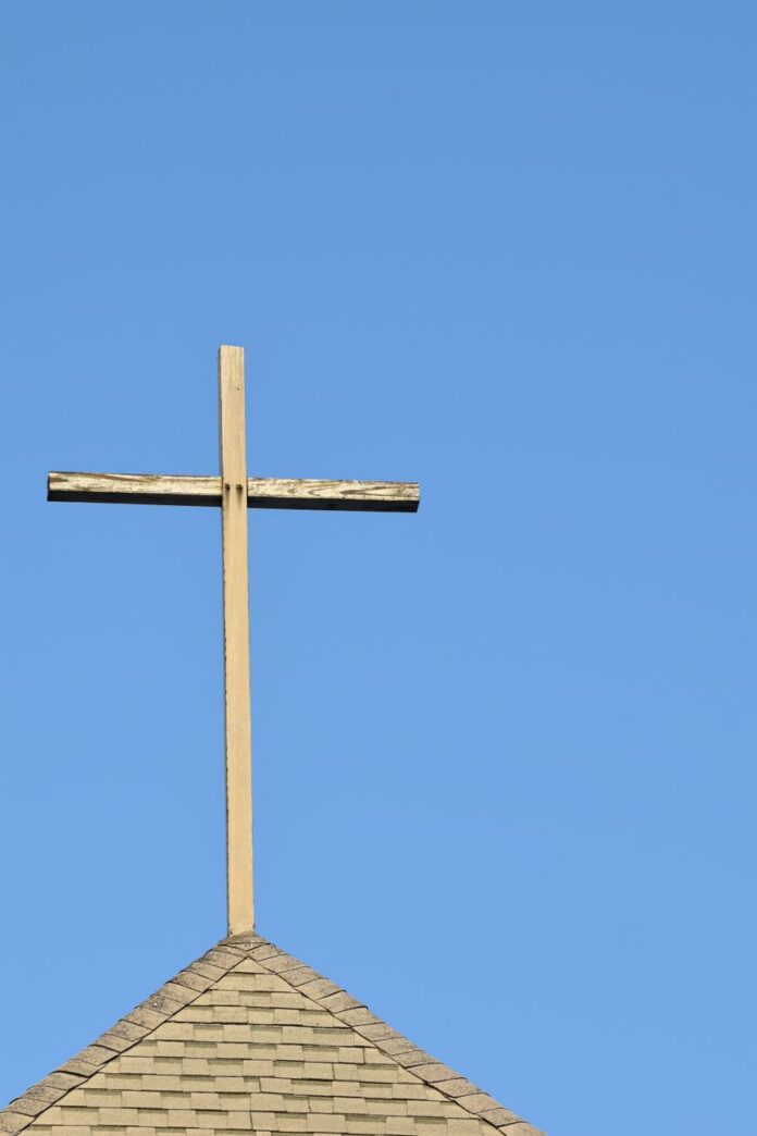 clear sky over cross on roof