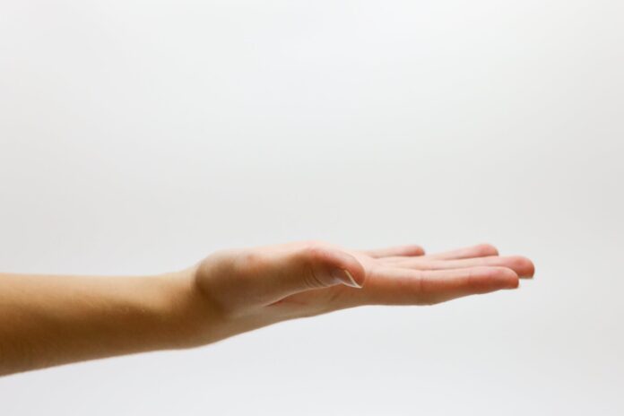 close up of hand over white background