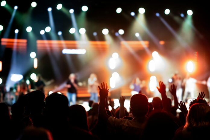 vibrant concert audience with stage lights