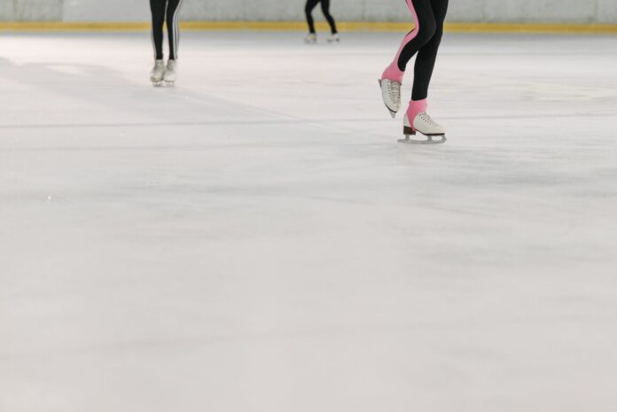 people wearing white ice skating shoes